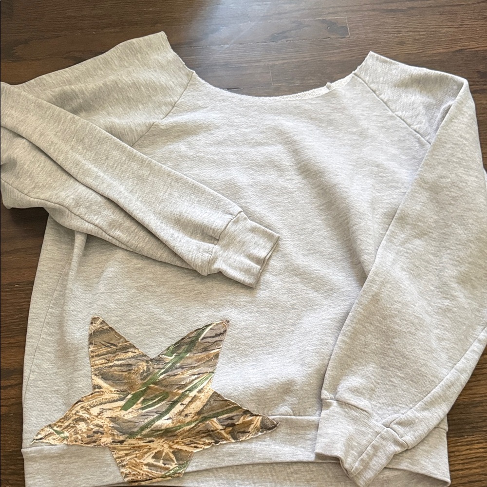 Off the shoulder sweatshirt with hand sewn decal